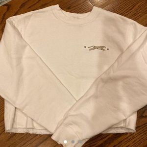 Brandy Melville white crewneck with cute back.